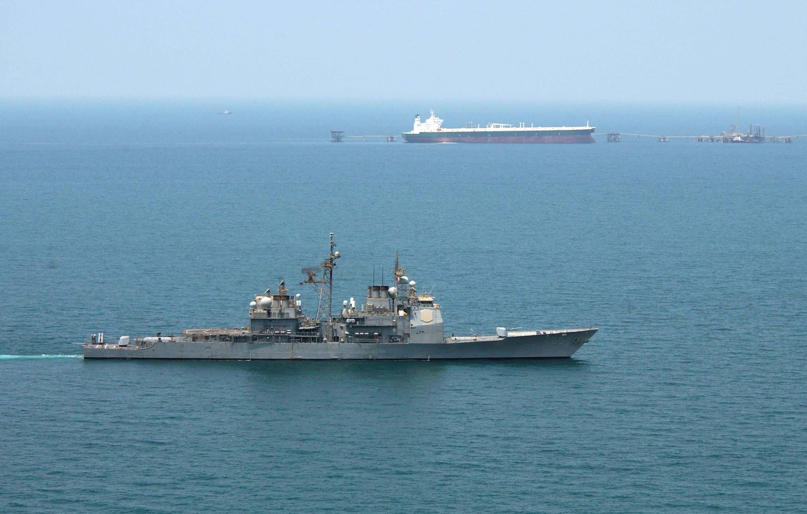 USS Chosin (CG 65) enforces an exclusionary perimeter as oil tanker AbQaiq receives crude oil at Mina-Al-Bkar terminal, Iraqi oil installation, June 2003