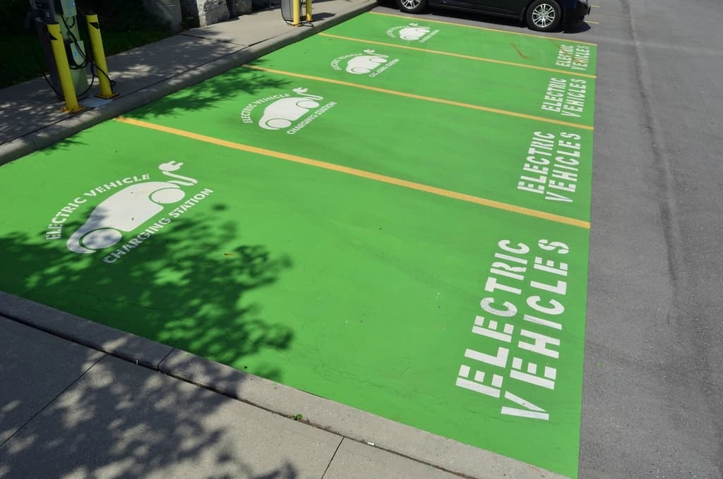 Row of EV charging stations in a parking facility